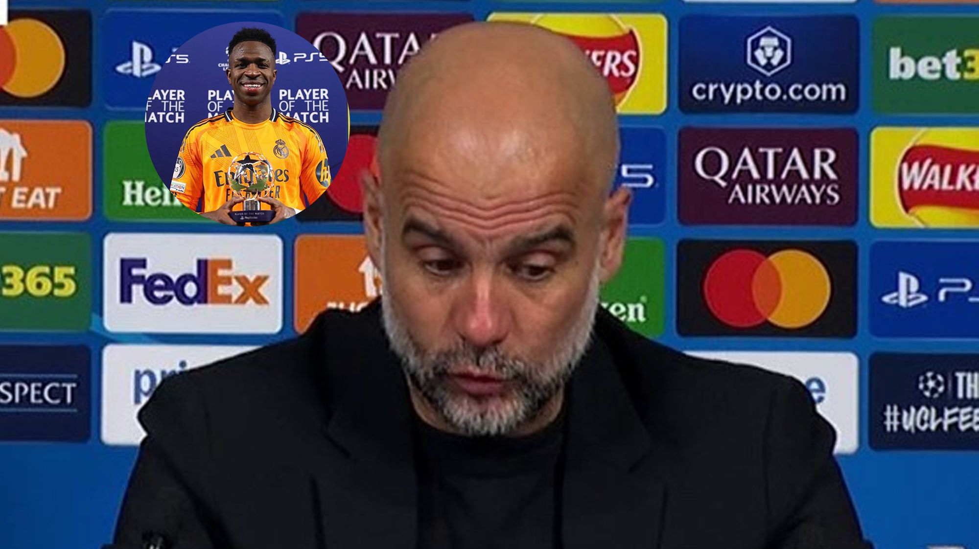 Pep Guardiola y una foto de Vinícius.